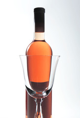 Rose wine and wine glass, studio isolated
