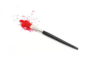 red  paint and brush