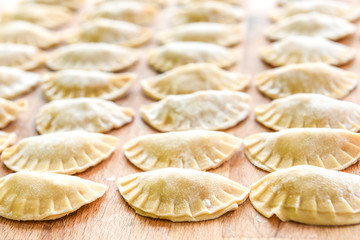 Making of homemade dumplings pastry tortellini or ravioli