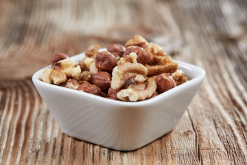Walnuts in a white china dish