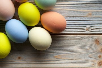 Colored Easter eggs on wooden planks