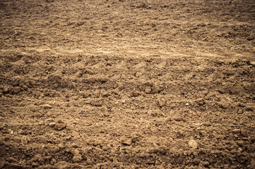 Ploughed field, soil close up, agricultural background