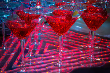 Red cocktail in Martini glasses