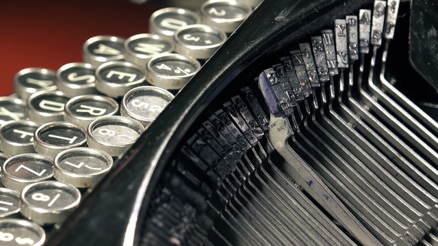 Old typewriter machine detail, typing text on vintage typing machine.