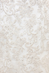 Background texture of white fabric with embroidery