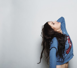 Naklejka premium High fashion beautiful girl in the sweater in the studio