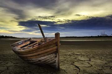 Boat crash landing land with dry and cracked ground. Desert