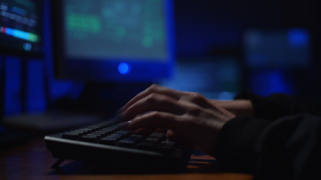 keyboard, a girl hacker cracks a password