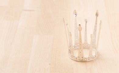 Royal crown with wood background