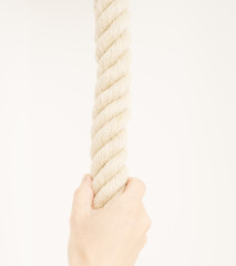 Hand holding strong rope