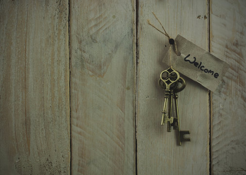 Antique keys on wooden background