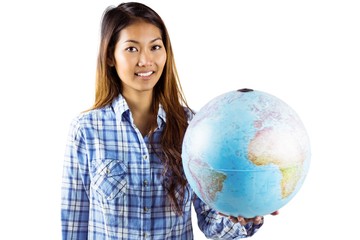 Fototapeta premium Smiling asian woman holding a globe