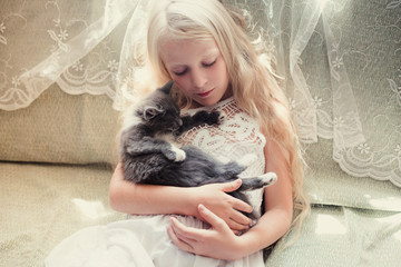 Baby girl hugging kitten, pet, friend, lifestyle