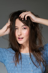 Fototapeta premium charming girl playing with her hair