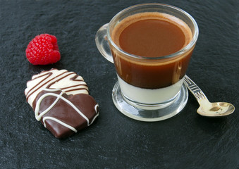 Сup of coffee espresso with milk and chocolate candies