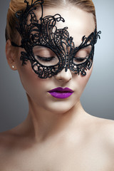 beautiful woman in a black mask. carnival mask Close-up female portrait.
