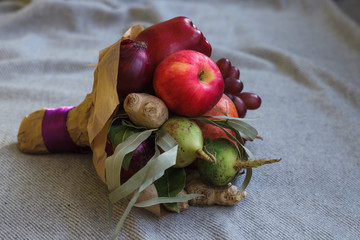 Fruits and vegetables are collected in a bouquet