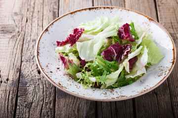 Green salad in a  bowl.Capriccio.selective focus.