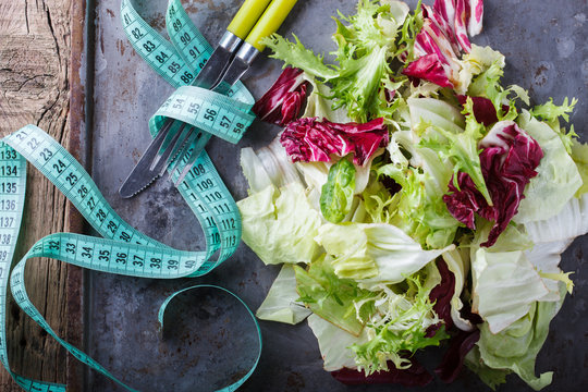 Green salad on the metal dish.Health food,vegetarian.selective focus.