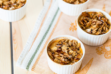 Tasty Dessert from Coconut Milk, Almonds and Honey on Light White Wooden Background
