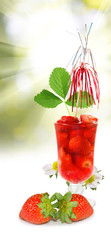 Image of strawberry cocktail against the sun