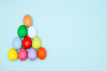 Colorful easter eggs on pastel background, Triangle Shape