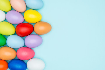 Colorful easter eggs on pastel background
