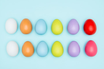 Colorful easter eggs on pastel background