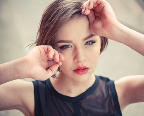 Fototapeta premium Vogue model in the black dress outdoor portrait