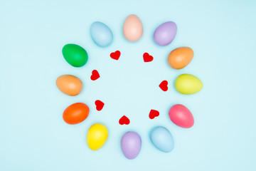Colorful easter eggs on pastel background
