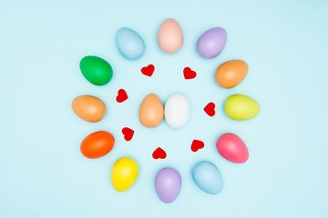 Colorful easter eggs on pastel background