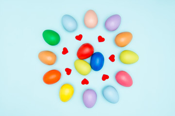 Colorful easter eggs on pastel background