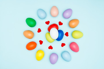 Colorful easter eggs on pastel background