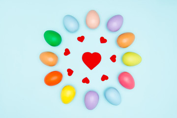 Colorful easter eggs on pastel background