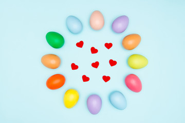 Colorful easter eggs on pastel background