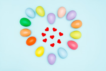 Colorful easter eggs on pastel background