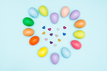 Colorful easter eggs on pastel background