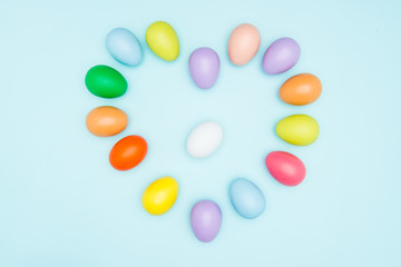 Colorful easter eggs on pastel background
