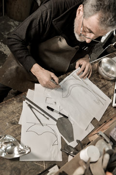 Master goldsmith working with silver-Creative drawing of a silve
