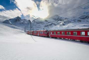 Swiss mountain train Bernina Express crossed through the high mo