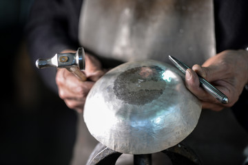 Master goldsmith working with silver-Put legal and punches from