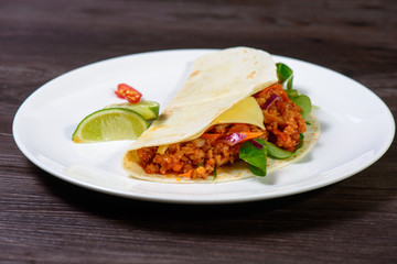 Tacos on a white plate