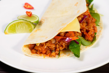 Tacos on a white plate