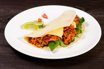 Tacos on a white plate