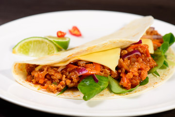 Tacos on a white plate