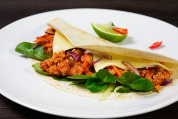 Tacos on a white plate
