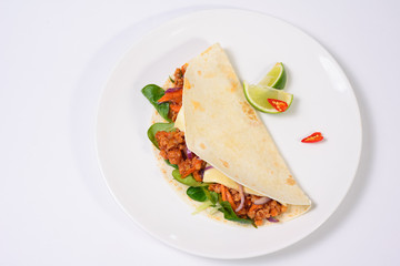 Tacos on a white plate