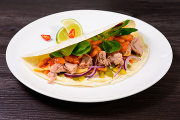 Tacos on a white plate