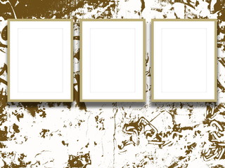 Close-up of three cream-coloured picture frames on brown ink splotchy background