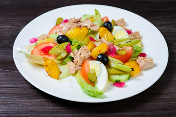 salad with meat,egg, tomatoes, olives and vegetables